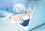 Man using computer privately with graphics overlaid on picture