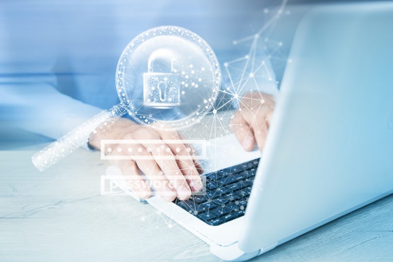 Man using computer privately with graphics overlaid on picture