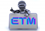 Robot holding sign reading "ETM" which stands for Emerging Tech Mastery