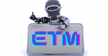 Robot holding sign reading "ETM" which stands for Emerging Tech Mastery