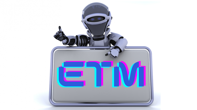 Robot holding sign reading "ETM" which stands for Emerging Tech Mastery