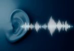 White Sound waves coming from light blue ear with dark blue back ground. Image Source: Freepik