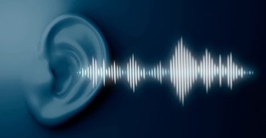White Sound waves coming from light blue ear with dark blue back ground. Image Source: Freepik